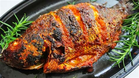 cooking tilapia fish on the grill